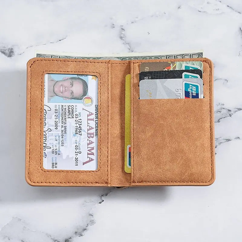 A brown leather multi-slot card wallet containing a driver's license and several credit cards.