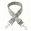 A beige and gray patterned nylon shoulder strap for bags and purses.