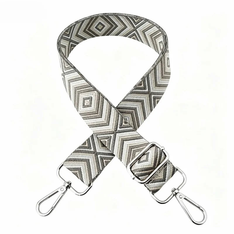 A beige and gray patterned nylon shoulder strap for bags and purses.