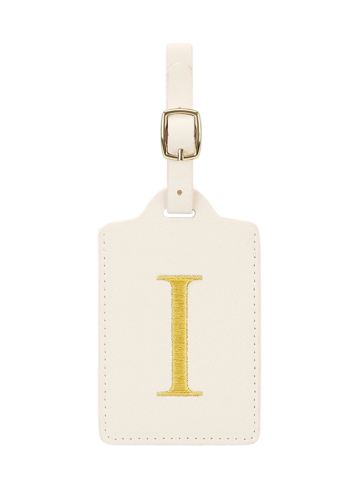 Étiquette de bagage rectangulaire en cuir crème avec un I brodé en or et une pince métallique argentée.