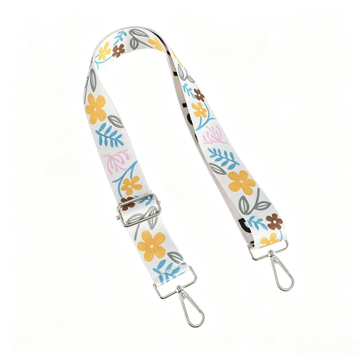 A light-colored nylon crossbody bag strap featuring a floral pattern and a metal buckle.