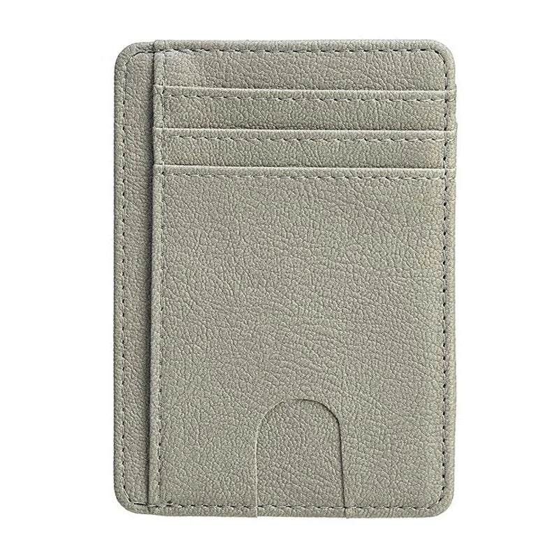 A slim gray leather wallet with multiple card slots and a cutout for cash.