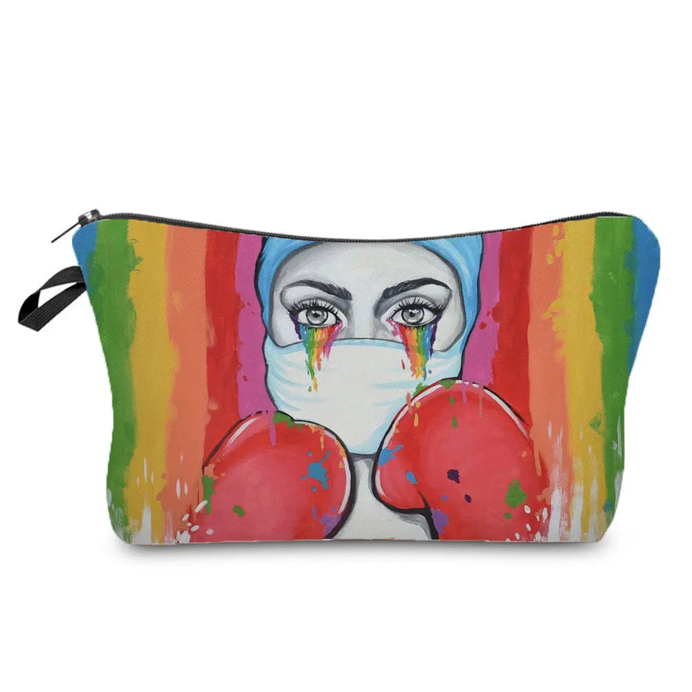 A colorful cosmetic storage pouch featuring a face design with dripping paint and bright stripes.