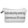 A white double-sided printing cosmetic bag with a black strap, designed to be customized.