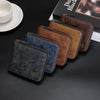 A collection of brown and blue leather zipper wallets displayed on a dark surface.